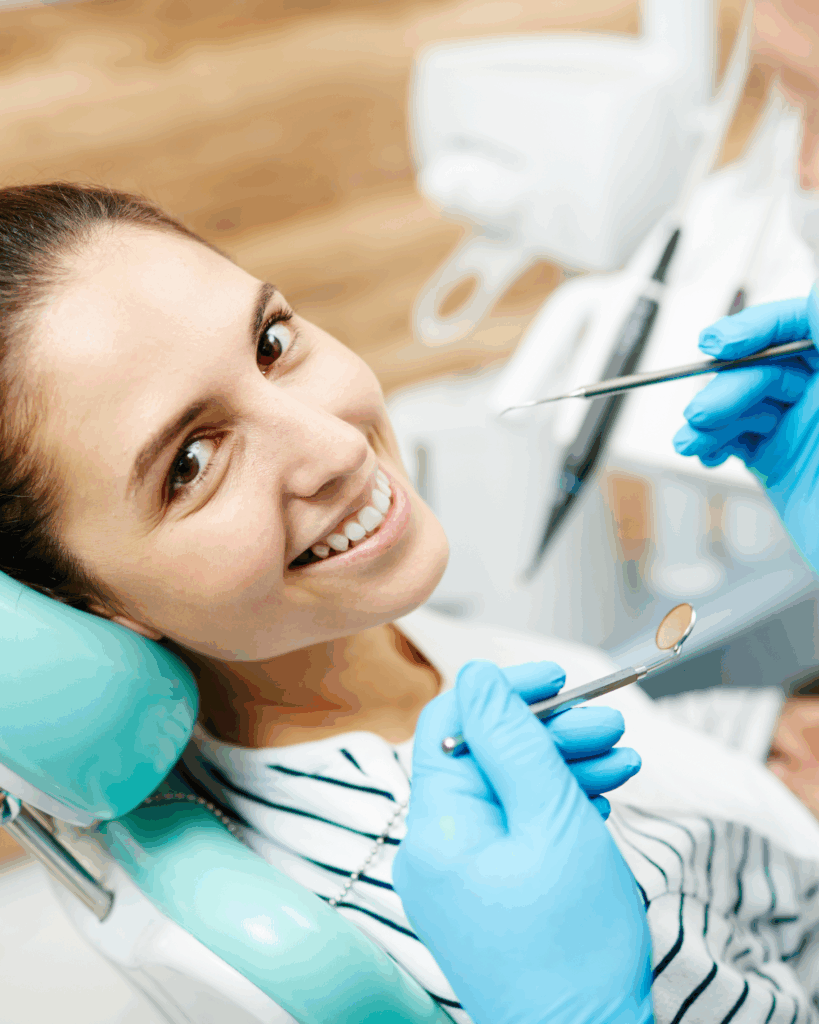 patient in a dental chair smiling, porcelain veneers near Redland Bay