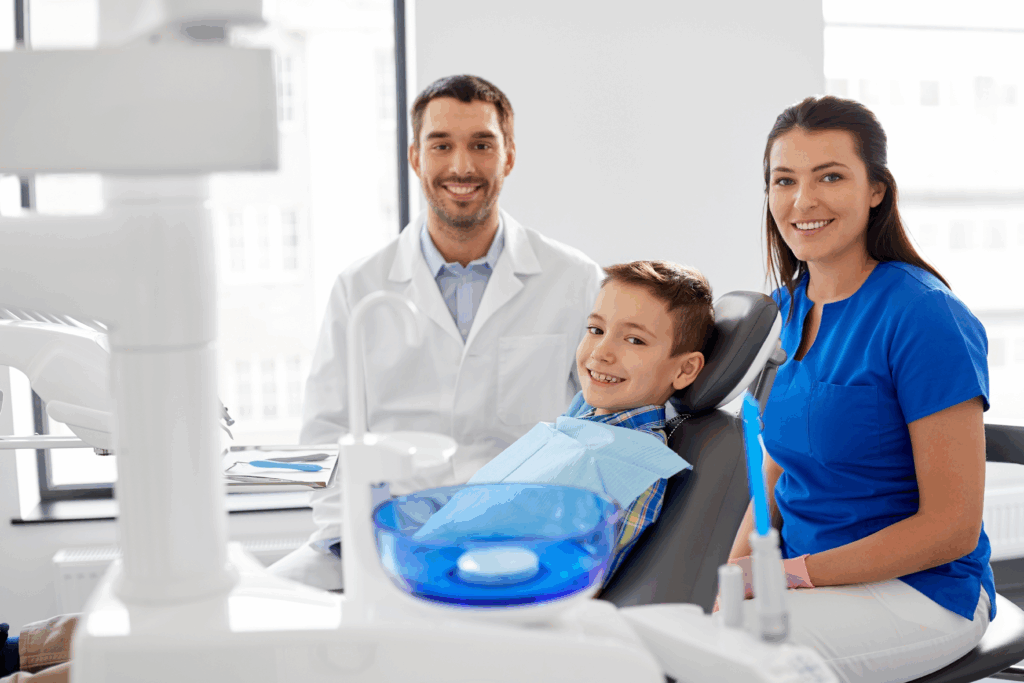 Happy kid at a dental clinic being checked.